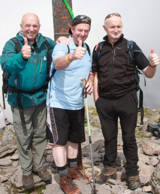 Enda Kenny Taoiseach of Ireland (Prime Minister) 2011 to 2017 on the Summit of Ireland's highest Mountain with guide and explorer Pat Falvey and Joe O'Leary.