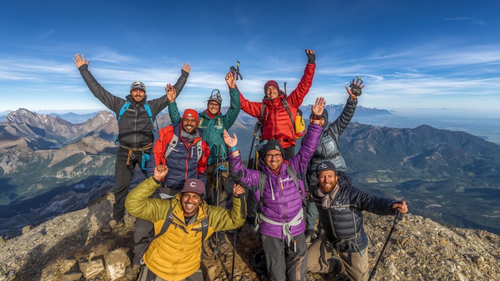 Setting goals and celebrating milestone achievements on mountain summits
