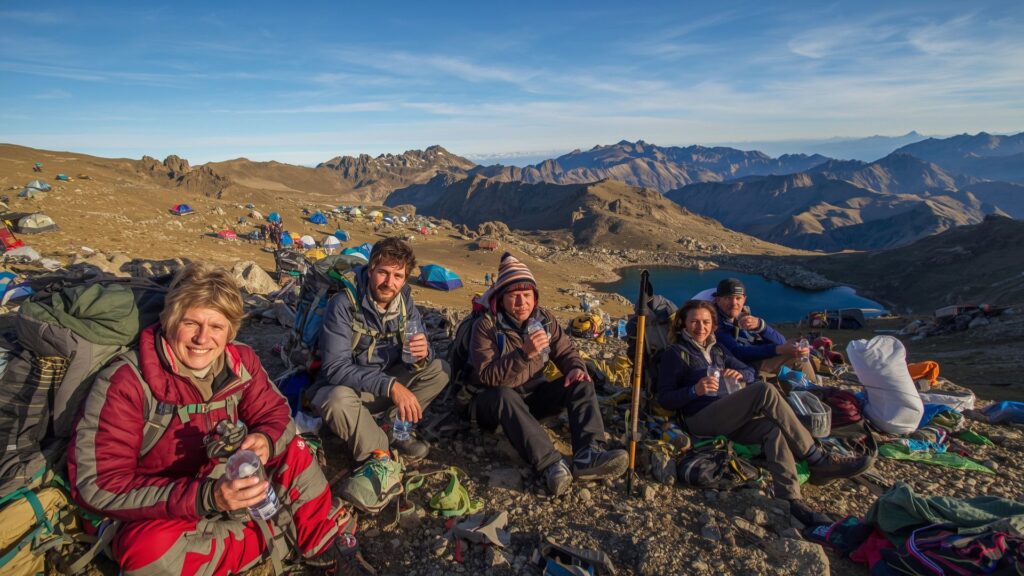 Trekkers preventing altitude sickness through proper hydration at mountain camp