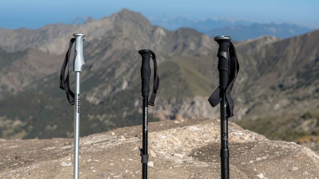 Comparison of different trekking poles materials including aluminium and carbon fibre options for hikers