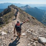 Leadership in action as mountain guide leads hiking team up challenging terrain towards summit