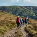 Beginner hiking tips in action as new hikers follow marked trail through Kerry mountains with proper gear and guidance
