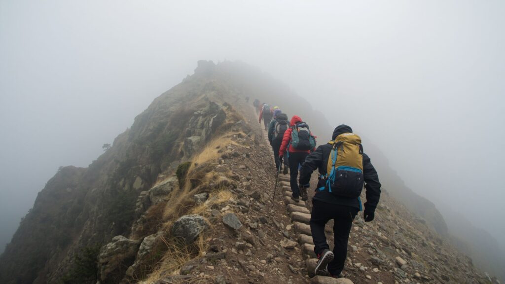 Mountain climbers applying Don't Quit principles during challenging ascent with Pat Falvey guides