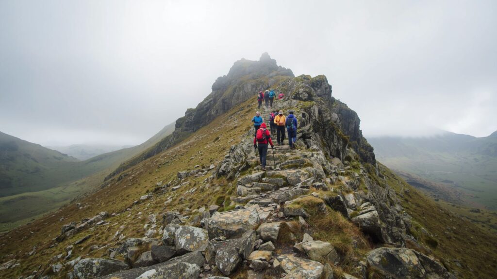 Building courage on Carrauntoohil Devil's Ladder with hikers conquering steep terrain