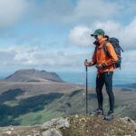 Layering up properly on Carrauntoohil summit with three-layer hiking system in Irish mountain conditions