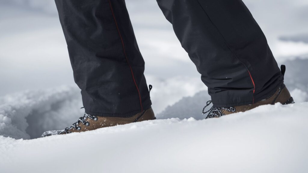Winter hiking tips for using gaiters to prevent snow entering boots during cold-weather treks