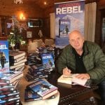 PAT FALVEY WITH HIS NEW BOOK. ACCIDENTAL REBEL