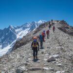 Altitude sickness prevention through gradual ascent on high-altitude mountain expedition with experienced guides